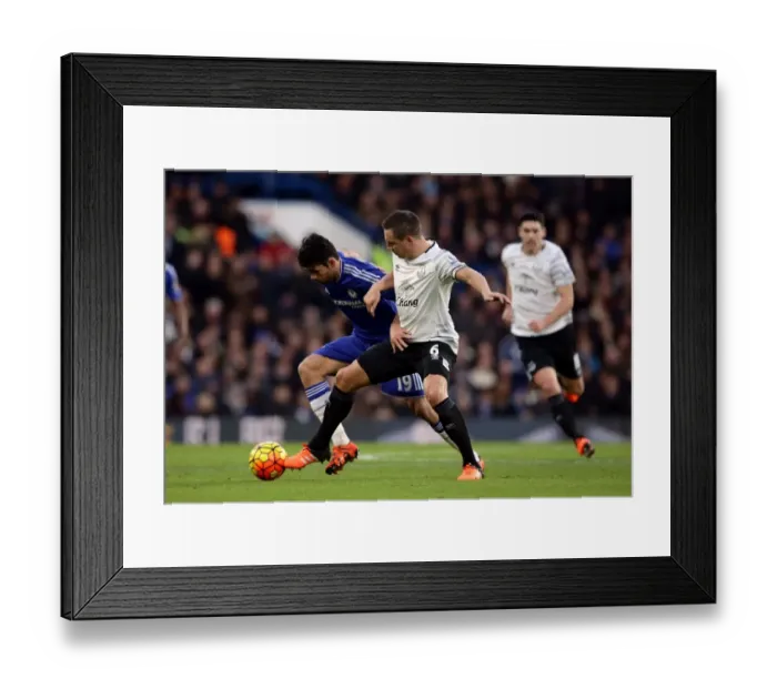 Framed Print : Battle for the Ball: Diego Costa vs. Phil Jagielka - Premier League Rivalry Framed Print : Battle for the Ball: Diego Costa vs. Phil Jagielka - Premier League Rivalry