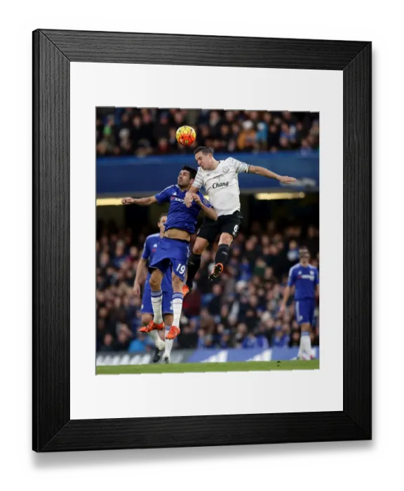 Framed Print : Premier League Rivalry: Diego Costa vs. Phil Jagielka - Battle for the Ball Framed Print : Premier League Rivalry: Diego Costa vs. Phil Jagielka - Battle for the Ball