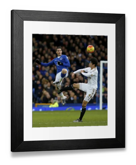Framed Print : Battle for the Ball: Oviedo vs Ki at Goodison Park - Everton vs Swansea City Framed Print : Battle for the Ball: Oviedo vs Ki at Goodison Park - Everton vs Swansea City