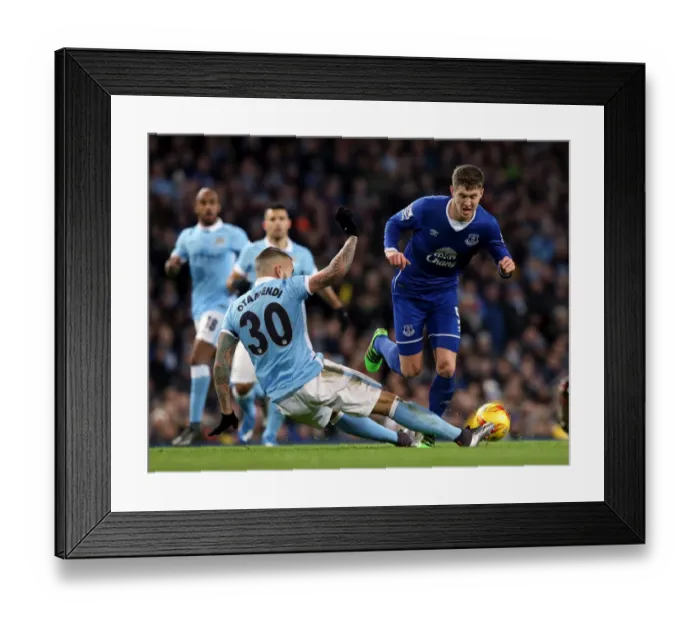 Framed Print : Otamendi vs. Stones: A Battle for Supremacy in the Capital One Cup Semi-Final Clash between Manchester City and Everton