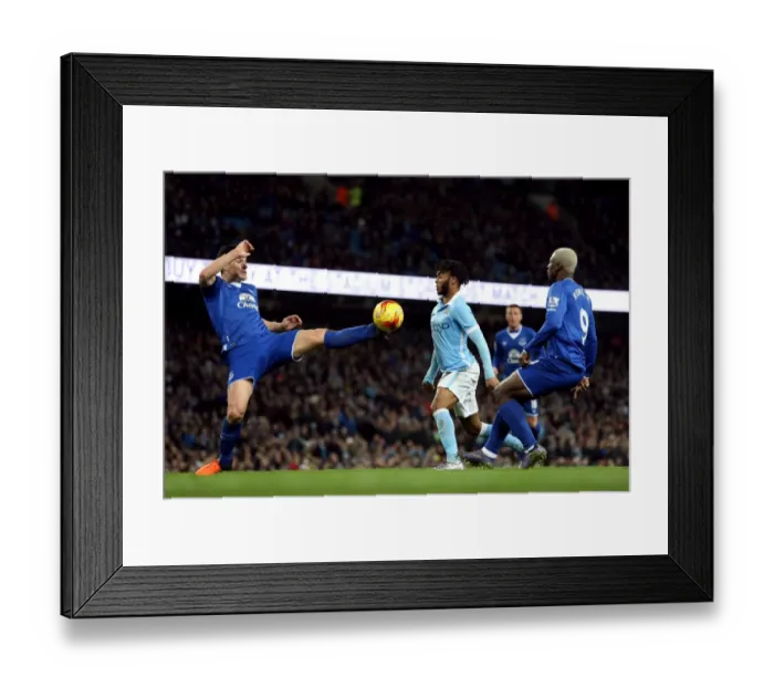 Framed Print : Gareth Barry vs Raheem Sterling: Intense Battle for the Ball in Everton vs Manchester City Capital One Cup Semi-Final Framed Print : Gareth Barry vs Raheem Sterling: Intense Battle for the Ball in Everton vs Manchester City Capital One Cup Semi-Final