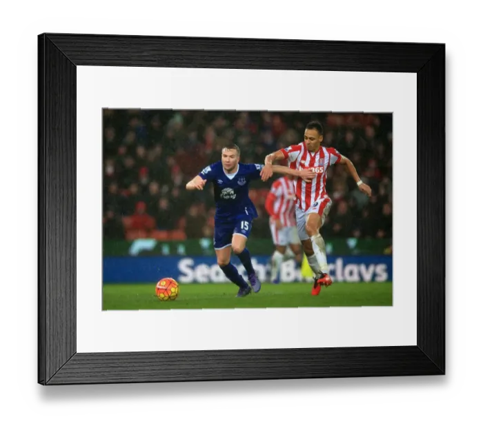 Framed Print : Battling for Ball Supremacy: Cleverley vs. Odemwingie - Everton vs. Stoke City, Premier League Framed Print : Battling for Ball Supremacy: Cleverley vs. Odemwingie - Everton vs. Stoke City, Premier League