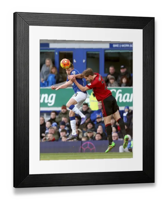Framed Print : Aerial Clash: Cleverley vs. Dawson at Goodison Park - Everton vs. West Bromwich Albion Framed Print : Aerial Clash: Cleverley vs. Dawson at Goodison Park - Everton vs. West Bromwich Albion
