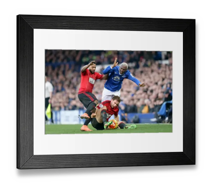 Framed Print : Intense Rivalry: Arouna Kone vs. Craig Dawson's Battle for the Ball at Goodison Park Framed Print : Intense Rivalry: Arouna Kone vs. Craig Dawson's Battle for the Ball at Goodison Park