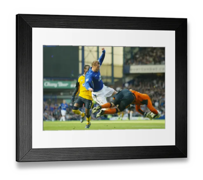 Framed Print : Determined Clash: Duncan Ferguson's Intense Challenge Against Wigan's Goalkeeper Framed Print : Determined Clash: Duncan Ferguson's Intense Challenge Against Wigan's Goalkeeper