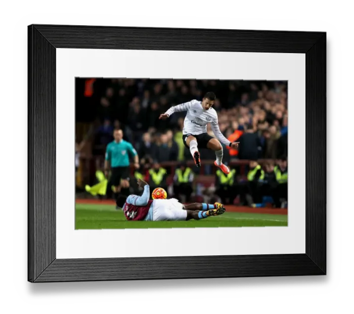 Framed Print : Mirallas Soars Past Richards: Thrilling Moment from Aston Villa vs. Everton in the Premier League Framed Print : Mirallas Soars Past Richards: Thrilling Moment from Aston Villa vs. Everton in the Premier League