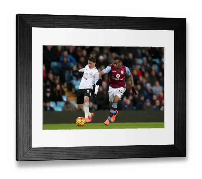 Framed Print : Battleground Villa Park: Oviedo vs. Ayew - Intense Clash in Premier League Football Framed Print : Battleground Villa Park: Oviedo vs. Ayew - Intense Clash in Premier League Football