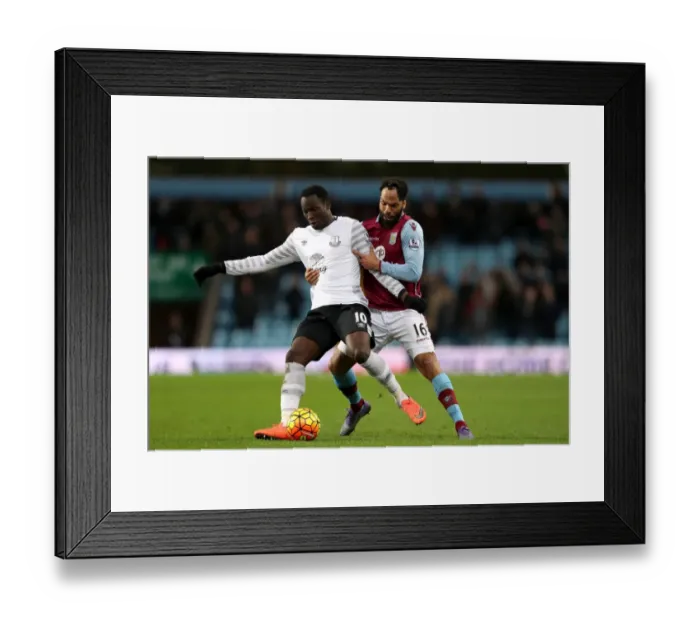 Framed Print : Lukaku vs. Lescott: A Premier League Battle for Ball Possession