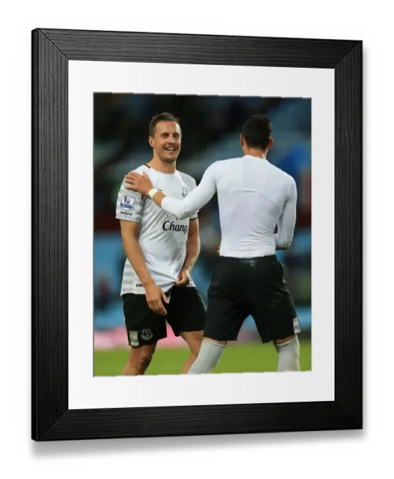 Framed Print : Everton's Jagielka and Funes Mori: Victory Celebration vs. Aston Villa in Premier League