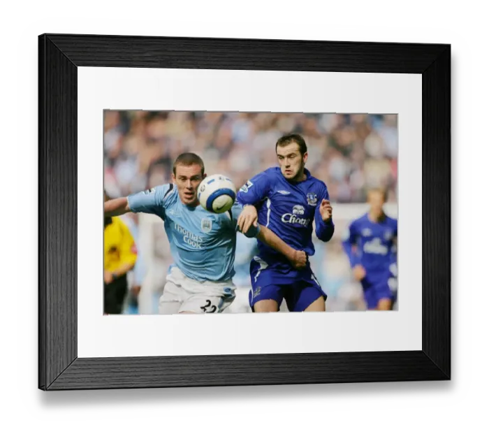 Framed Print : McFadden vs. Dunne: A Footballing Battle - Everton Rivals Clash Framed Print : McFadden vs. Dunne: A Footballing Battle - Everton Rivals Clash