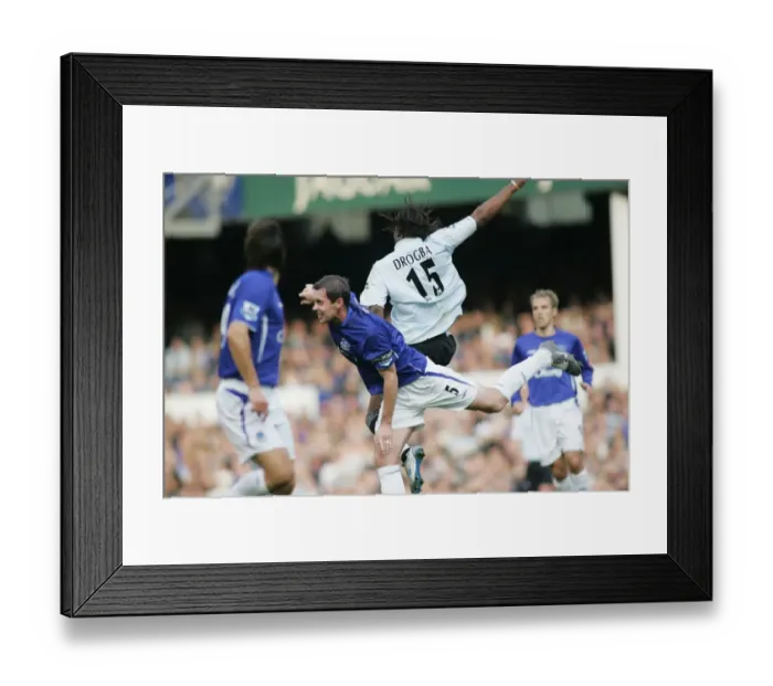 Framed Print : Intense Battle on the Football Field: David Weir vs. Didier Drogba