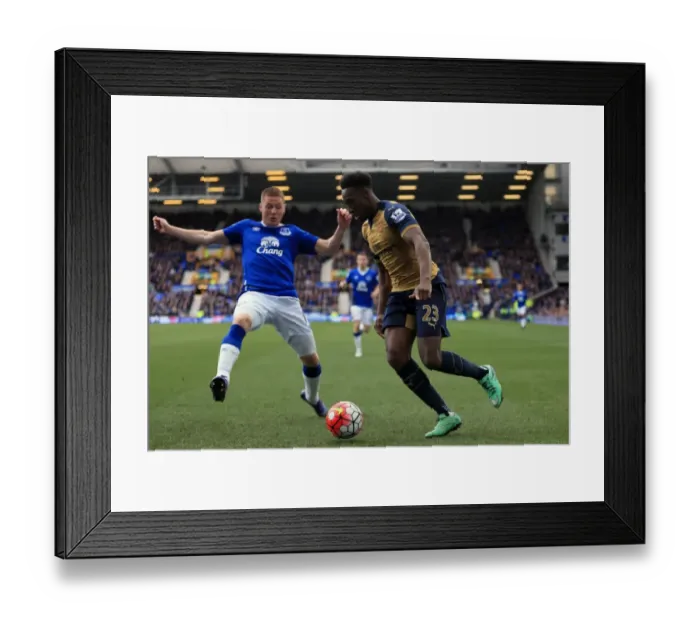 Framed Print : Battle for Supremacy: McCarthy vs. Welbeck - Everton vs. Arsenal, Barclays Premier League, Goodison Park Framed Print : Battle for Supremacy: McCarthy vs. Welbeck - Everton vs. Arsenal, Barclays Premier League, Goodison Park
