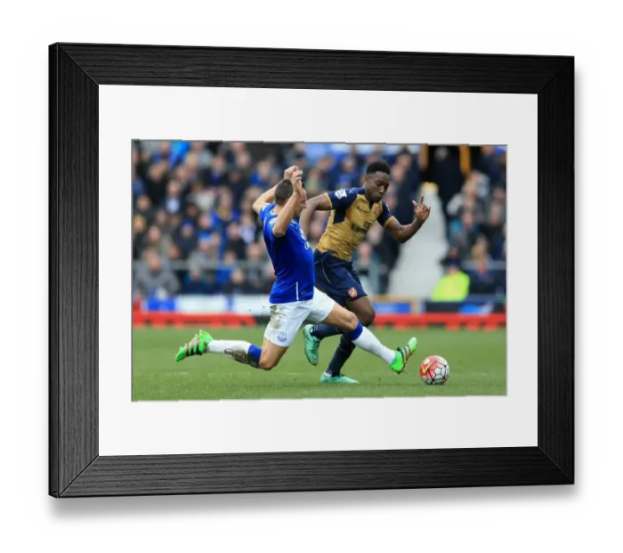 Framed Print : Jagielka vs Welbeck: A Football Battle at Goodison Park