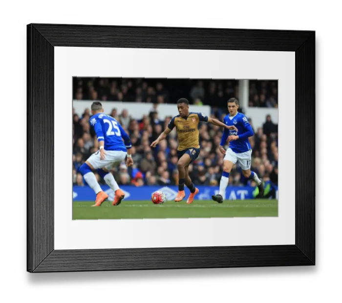 Framed Print : Battle for the Ball: Iwobi vs. Besic - Everton vs. Arsenal's Premier League Showdown at Goodison Park Framed Print : Battle for the Ball: Iwobi vs. Besic - Everton vs. Arsenal's Premier League Showdown at Goodison Park