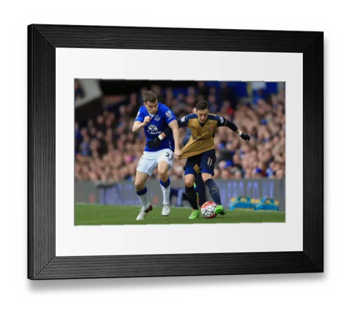 Framed Print : Seamus Coleman vs Mesut Ozil: Intense Rivalry at Goodison Park - Everton vs Arsenal, Barclays Premier League