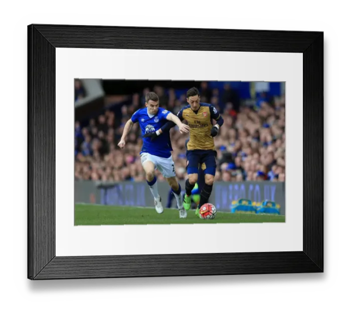 Framed Print : Seamus Coleman vs. Mesut Ozil: A Battle for the Ball at Goodison Park - Everton vs. Arsenal, Barclays Premier League