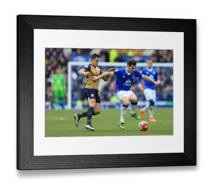 Framed Print : Clash at Goodison Park: Sanchez vs. Baines in Premier League Showdown