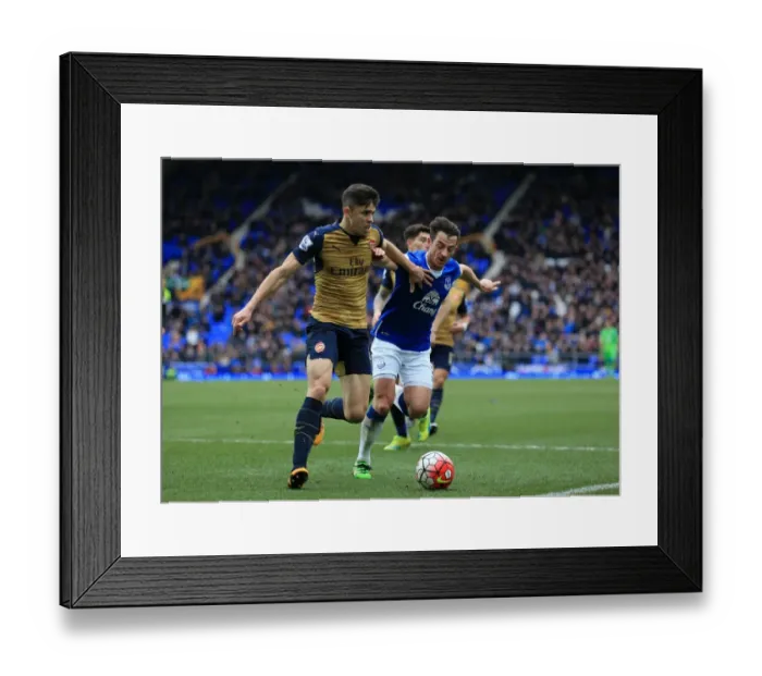 Framed Print : Clash of Titans: Paulista vs. Baines at Goodison Park - Everton vs. Arsenal, Premier League Framed Print : Clash of Titans: Paulista vs. Baines at Goodison Park - Everton vs. Arsenal, Premier League