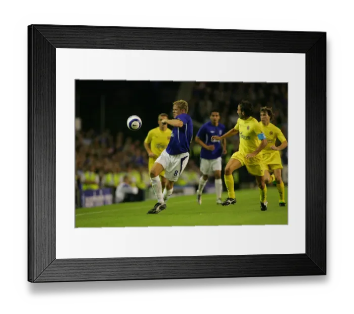Framed Print : Defying the Odds: James Beattie's Determined Run Against Villarreal's Defenders Framed Print : Defying the Odds: James Beattie's Determined Run Against Villarreal's Defenders