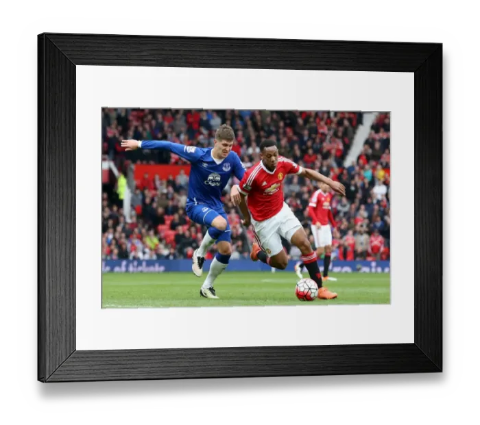 Framed Print : Manchester United vs. Everton: John Stones and Anthony Martial Clash in Barclays Premier League Match Framed Print : Manchester United vs. Everton: John Stones and Anthony Martial Clash in Barclays Premier League Match