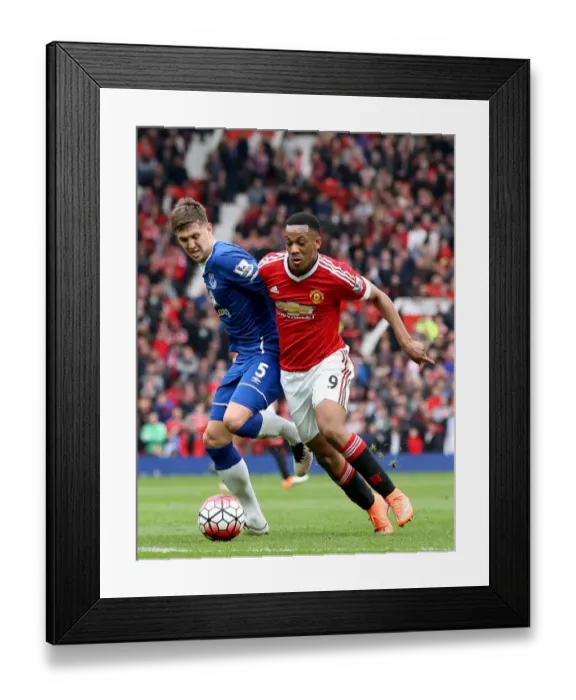 Framed Print : Manchester United vs. Everton: A Battle for the Ball - John Stones vs. Anthony Martial Framed Print : Manchester United vs. Everton: A Battle for the Ball - John Stones vs. Anthony Martial
