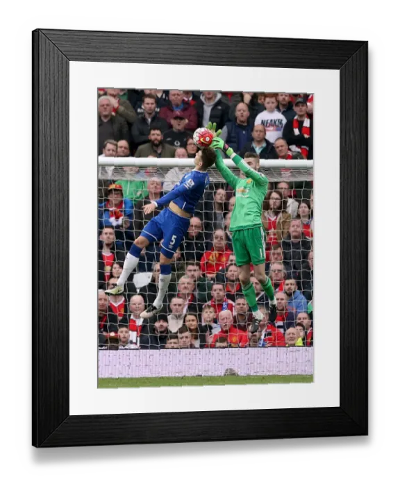 Framed Print : John Stones vs. David de Gea: Intense Battle for the Ball at Old Trafford - Manchester United vs. Everton, Premier League