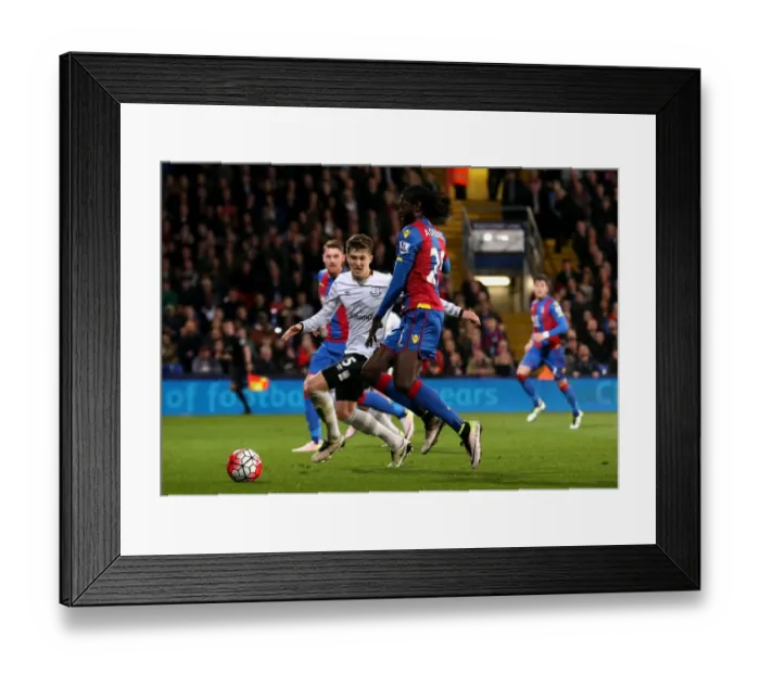 Framed Print : Adebayor vs Stones: Intense Shooting Moment at Selhurst Park - Crystal Palace vs Everton, Barclays Premier League Framed Print : Adebayor vs Stones: Intense Shooting Moment at Selhurst Park - Crystal Palace vs Everton, Barclays Premier League