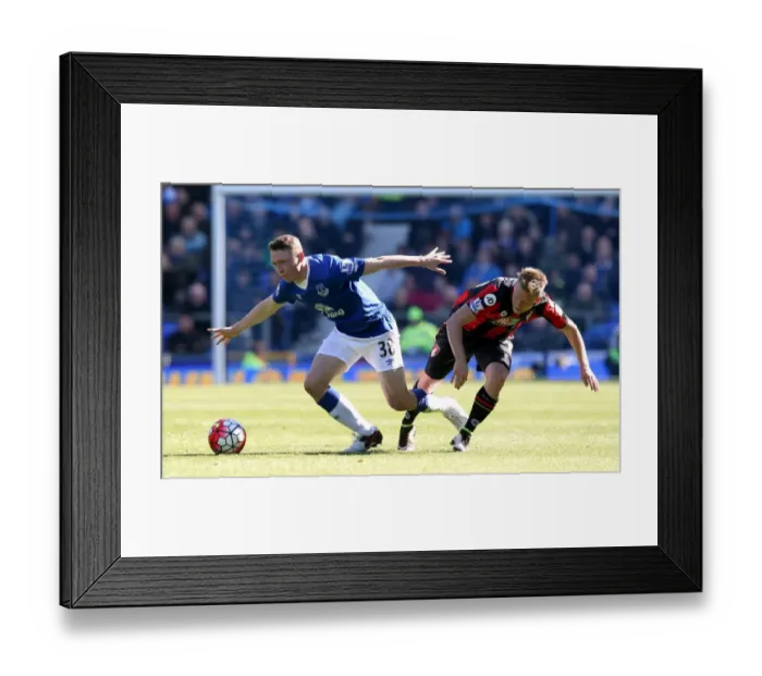 Framed Print : Everton vs. AFC Bournemouth: Pennington vs. Ritchie in Intense Battle at Goodison Park