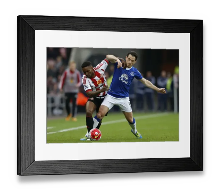 Framed Print : Baines vs Defoe: Intense Battle for Ball Possession - Sunderland vs Everton, Barclays Premier League Framed Print : Baines vs Defoe: Intense Battle for Ball Possession - Sunderland vs Everton, Barclays Premier League