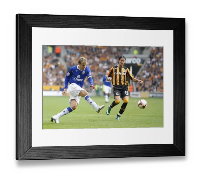 Framed Print : Phil Neville's Determined Shot Against Hull City in the Barclays Premier League, 2008