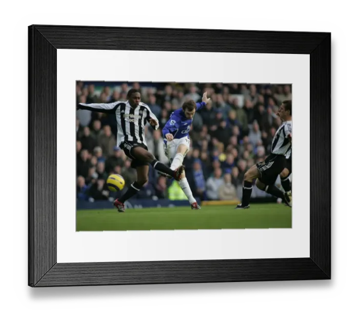 Framed Print : McFadden's Determination: Focused Shot Amidst Babayaro's Defensive Pressure Framed Print : McFadden's Determination: Focused Shot Amidst Babayaro's Defensive Pressure