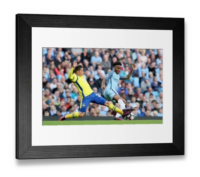 Framed Print : Manchester City vs. Everton: Bryan Oviedo vs. Raheem Sterling - Intense Battle for Ball Possession (Premier League) Framed Print : Manchester City vs. Everton: Bryan Oviedo vs. Raheem Sterling - Intense Battle for Ball Possession (Premier League)