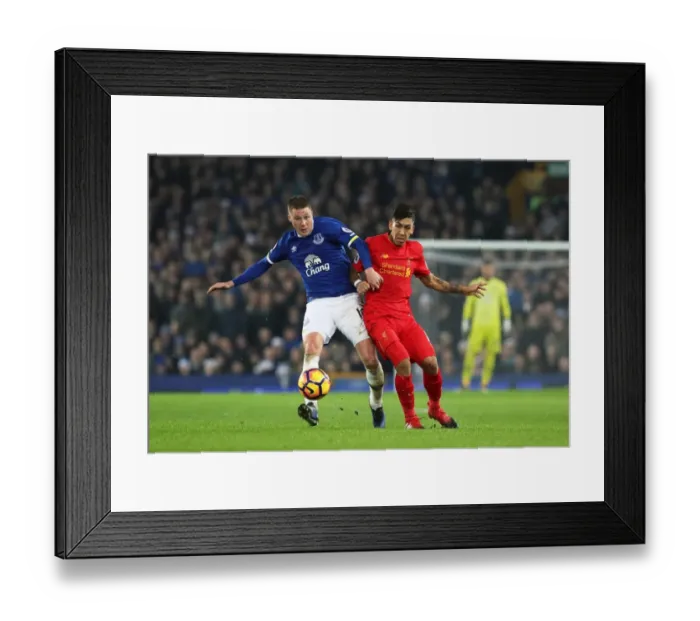 Framed Print : Everton vs Liverpool: McCarthy vs Firmino - Intense Battle for Ball at Goodison Park Framed Print : Everton vs Liverpool: McCarthy vs Firmino - Intense Battle for Ball at Goodison Park