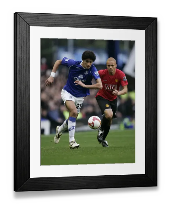 Framed Print : Fellaini vs. Brown: Everton vs. Manchester United Clash in the Barclays Premier League (08 / 09) Framed Print : Fellaini vs. Brown: Everton vs. Manchester United Clash in the Barclays Premier League (08 / 09)