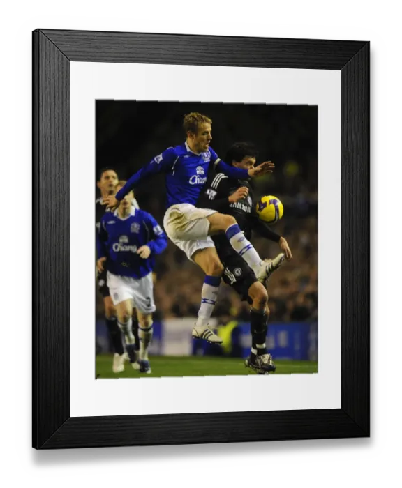 Framed Print : Phil Neville vs Michael Ballack: Clash of the Titans - Everton vs Chelsea, Barclays Premier League, 2008-09 Framed Print : Phil Neville vs Michael Ballack: Clash of the Titans - Everton vs Chelsea, Barclays Premier League, 2008-09