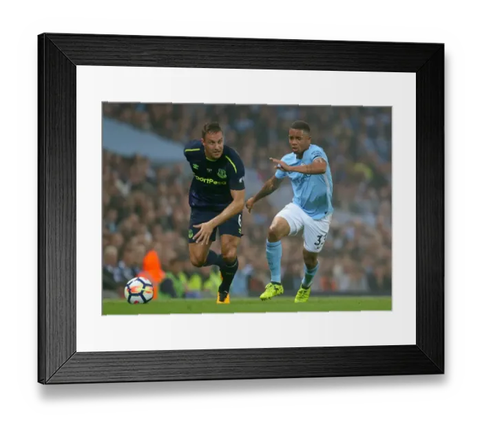 Framed Print : Manchester City vs. Everton: Jagielka vs. Jesus - Premier League Battle at Etihad Stadium Framed Print : Manchester City vs. Everton: Jagielka vs. Jesus - Premier League Battle at Etihad Stadium