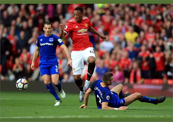 Manchester United vs. Everton: Anthony Martial Wins Contested Ball Against Morgan Schneiderlin, Resulting in Penalty Call