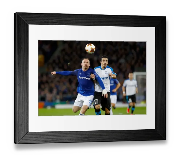Framed Print : Rooney vs. Cunha: Battle for the Ball in UEFA Europa League Group E - Everton vs. Apollon Limassol at Goodison Park Framed Print : Rooney vs. Cunha: Battle for the Ball in UEFA Europa League Group E - Everton vs. Apollon Limassol at Goodison Park
