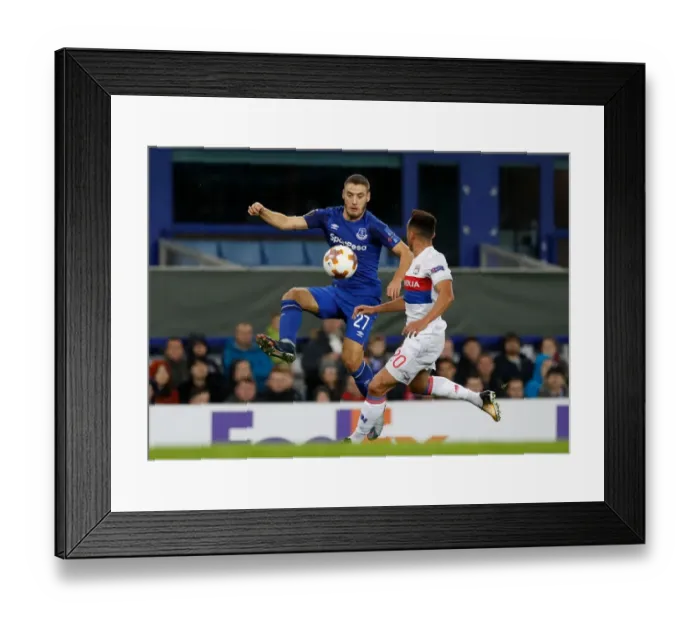 Framed Print : Everton vs. Olympique Lyonnais - Group E Clash: A Battle for the Ball (Nikola Vlasic vs. Marcal)