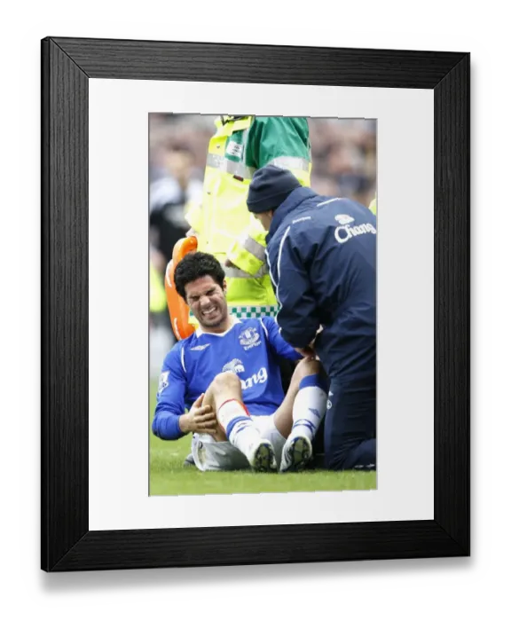Framed Print : Mikel Arteta Suffers Injury: Everton's Midfielder Carried Off in Newcastle Clash (2009)