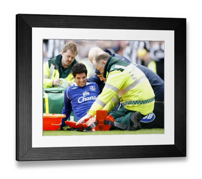 Framed Print : Mikel Arteta's Injury Woes: Carried Off in Newcastle vs. Everton (2009) Framed Print : Mikel Arteta's Injury Woes: Carried Off in Newcastle vs. Everton (2009)