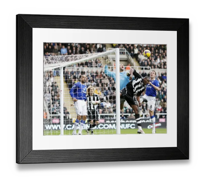 Framed Print : Ameobi vs. Howard: Battle at St. James Park - Everton's Tim Howard Clashes with Newcastle's Shola Ameobi in Premier League Match (08 / 09) Framed Print : Ameobi vs. Howard: Battle at St. James Park - Everton's Tim Howard Clashes with Newcastle's Shola Ameobi in Premier League Match (08 / 09)