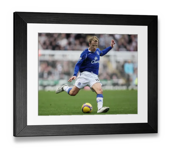 Framed Print : Phil Neville of Everton Faces Off Against Newcastle United in Barclays Premier League Action, 2009 Framed Print : Phil Neville of Everton Faces Off Against Newcastle United in Barclays Premier League Action, 2009