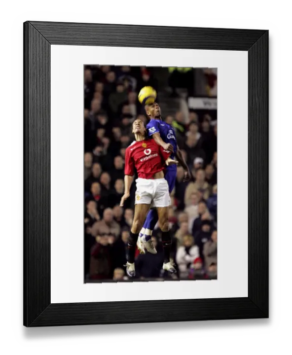 Framed Print : Marcus Bent Soars Over Rio Ferdinand: An Epic Football Moment Framed Print : Marcus Bent Soars Over Rio Ferdinand: An Epic Football Moment