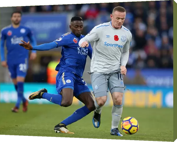 Leicester City vs Everton: Intense Battle for the Ball between Wilfred Ndidi and Wayne Rooney