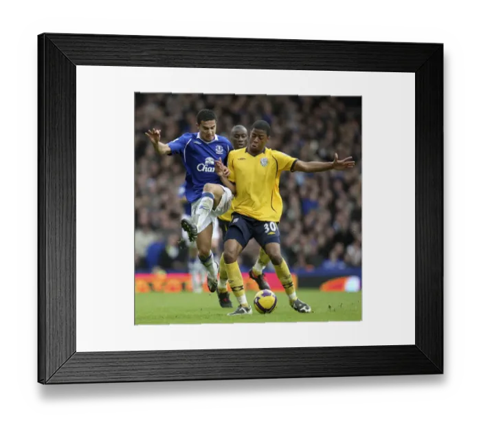 Framed Print : Clash of the Titans: Tim Cahill vs. Ryan Donk - Everton vs. West Bromwich Albion, Barclays Premier League (Feb. 28, 2009) Framed Print : Clash of the Titans: Tim Cahill vs. Ryan Donk - Everton vs. West Bromwich Albion, Barclays Premier League (Feb. 28, 2009)