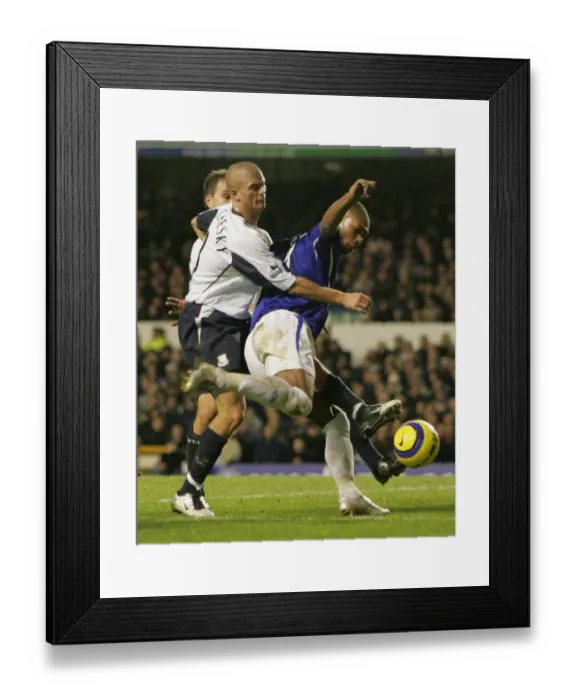 Framed Print : Marcus Bent vs. Paul Konchesky: A Footballing Battle - The Intense Tussle Between Everton's Bent and Fulham's Konchesky Framed Print : Marcus Bent vs. Paul Konchesky: A Footballing Battle - The Intense Tussle Between Everton's Bent and Fulham's Konchesky