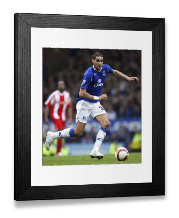 Framed Print : Marouane Fellaini's Intense Battle: Everton vs Stoke City, 2009 Football Rivalry Framed Print : Marouane Fellaini's Intense Battle: Everton vs Stoke City, 2009 Football Rivalry