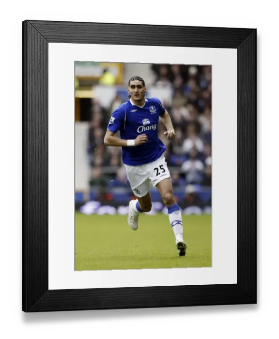 Framed Print : Marouane Fellaini's Thrilling Performance: Everton vs Stoke City, Barclays Premier League, March 14, 2009