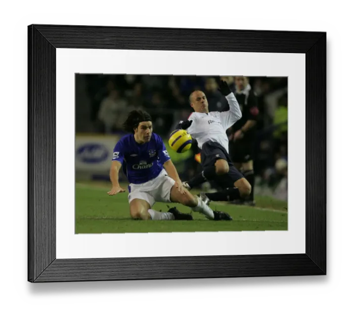 Framed Print : Everton Football Club: A Moment of Drama - Stelios and Nuno Valente's Intense Clash on the Field Framed Print : Everton Football Club: A Moment of Drama - Stelios and Nuno Valente's Intense Clash on the Field